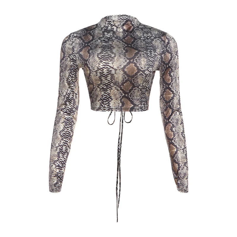 Top met lange mouwen en ronde hals, met slangenprint en strikceintuur