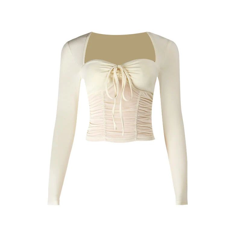 Top met lange mouwen, geplooide details en strikceintuur, effen mesh-stof.