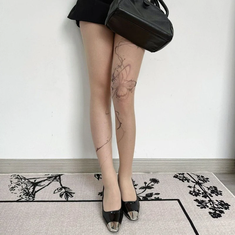 Doorschijnende mesh panty met vlinderprint