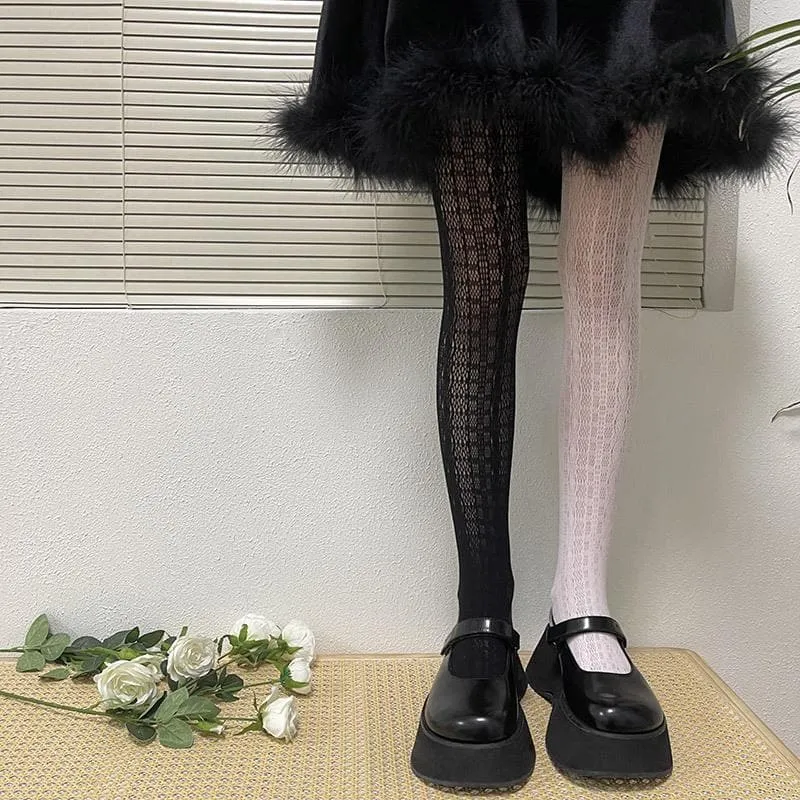 Contrasterende panty met doorschijnende kanten uitsparing