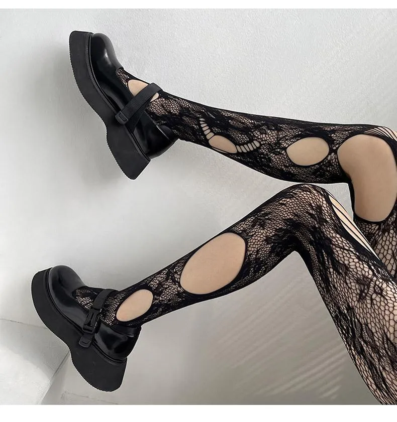 Visnet panty met uitgehold bloemenpatroon